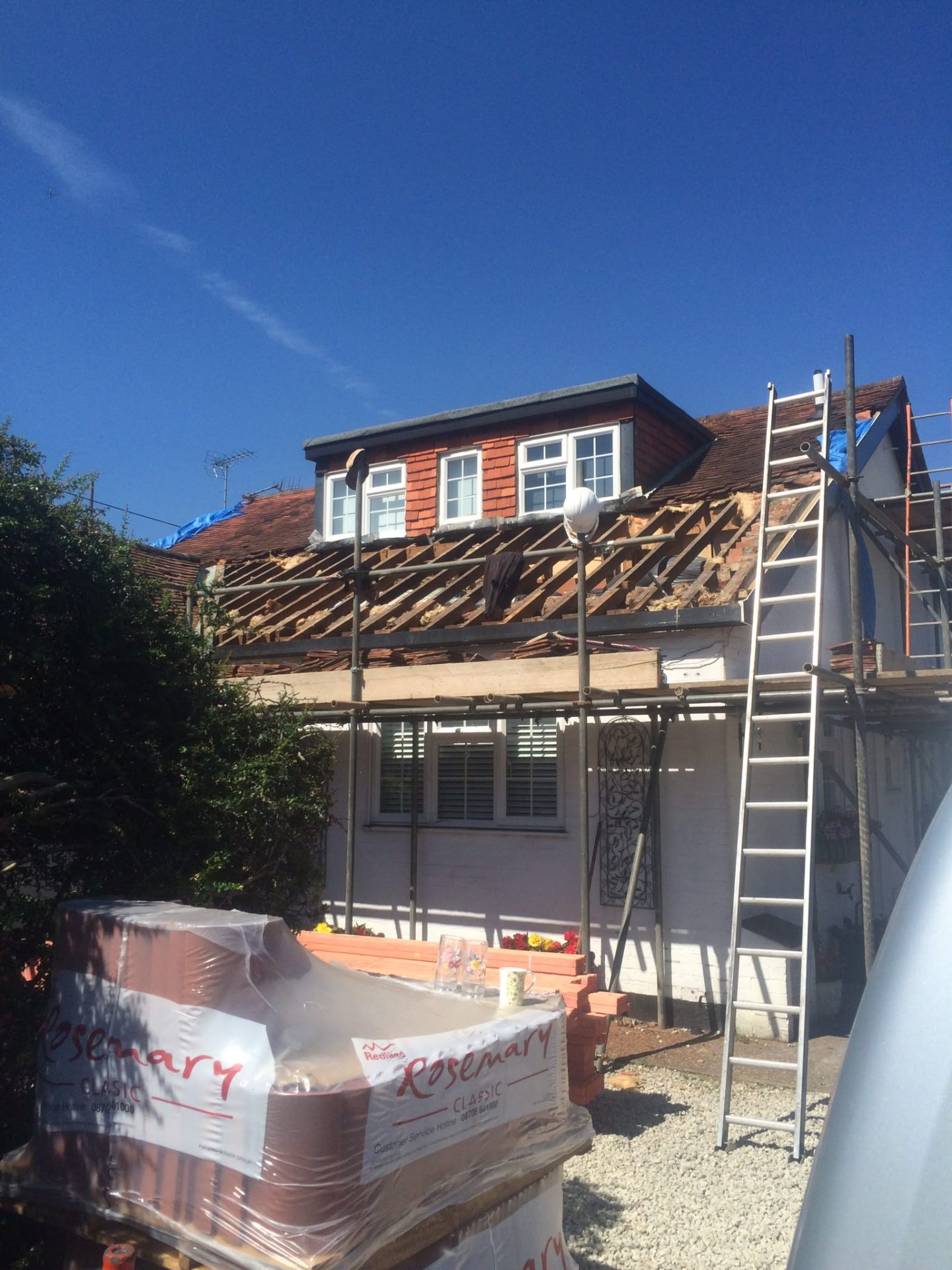 Strip and re-tile in progress with new membrane and treated battens