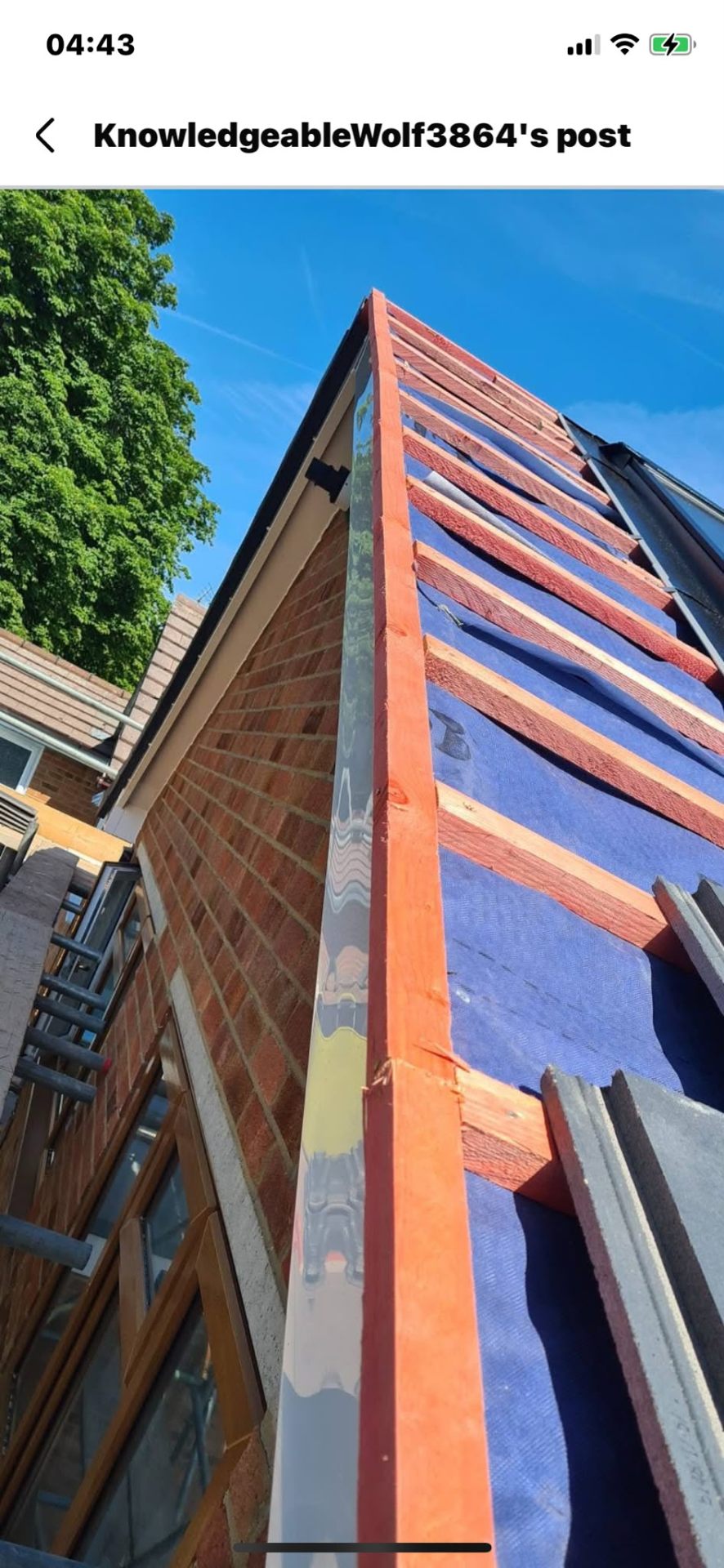 Dry verge gable detail alongside new tiles